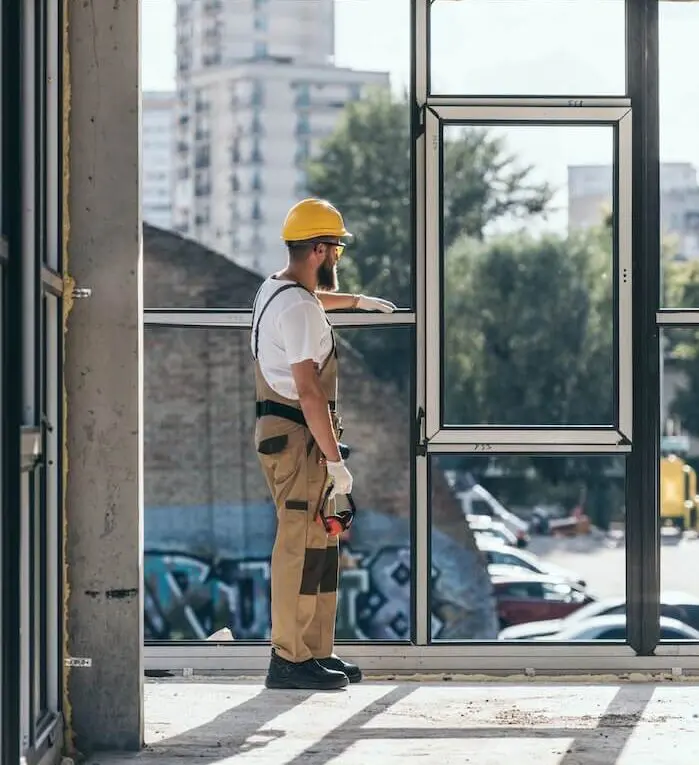 Construction worker inspecting building site