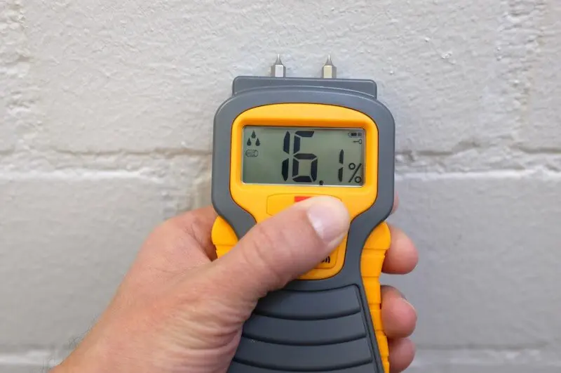 Moisture meter reading construction wall