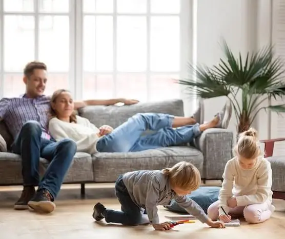 Family relaxing in living room